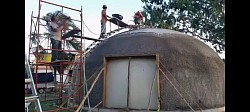 Spraying concrete, then basalt fiber reenforcement, XPS insulation, then more concrete (Equip)